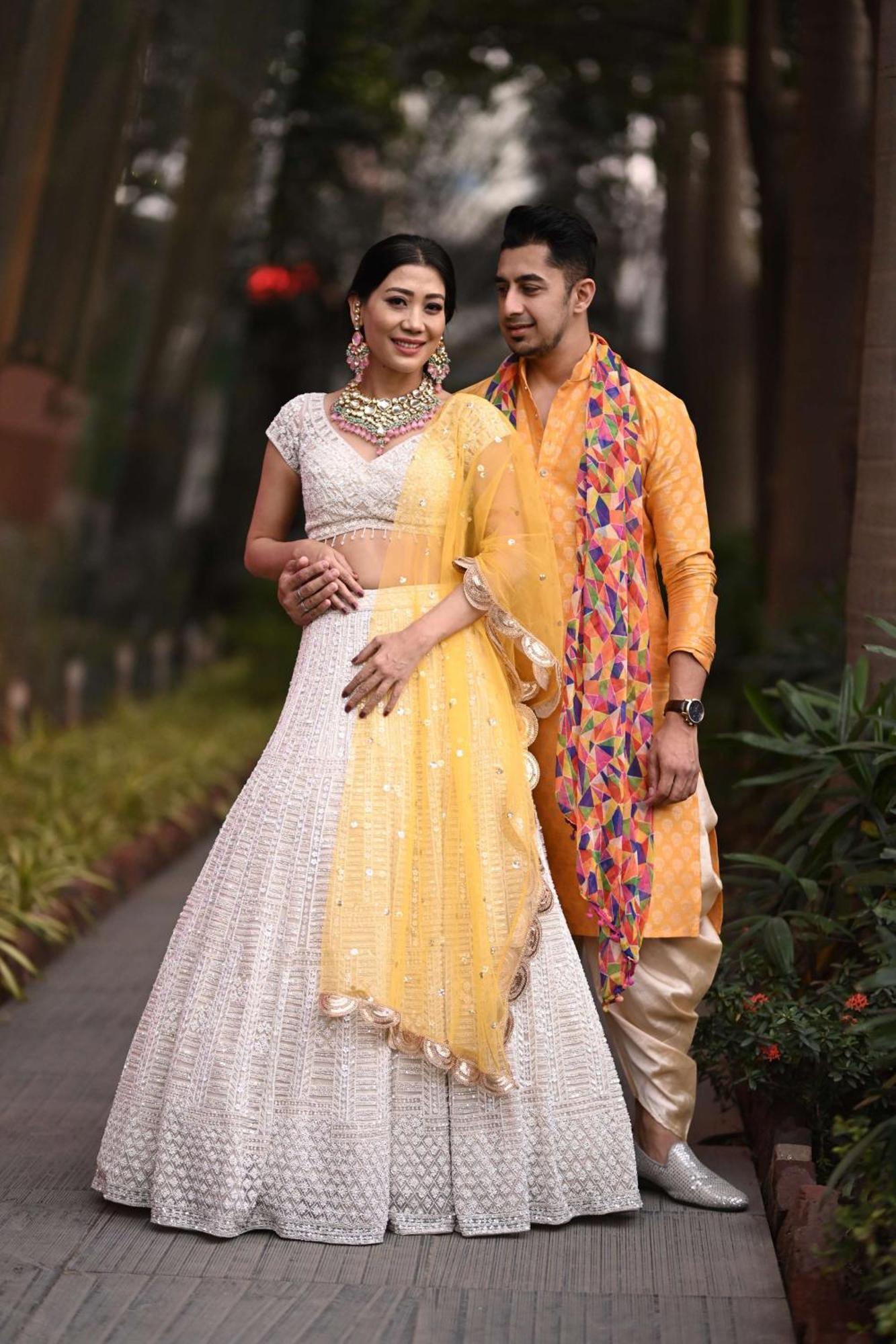 Radisson Blu Hotel Pune Kharadi Exterior photo A couple wearing traditional Indian clothing